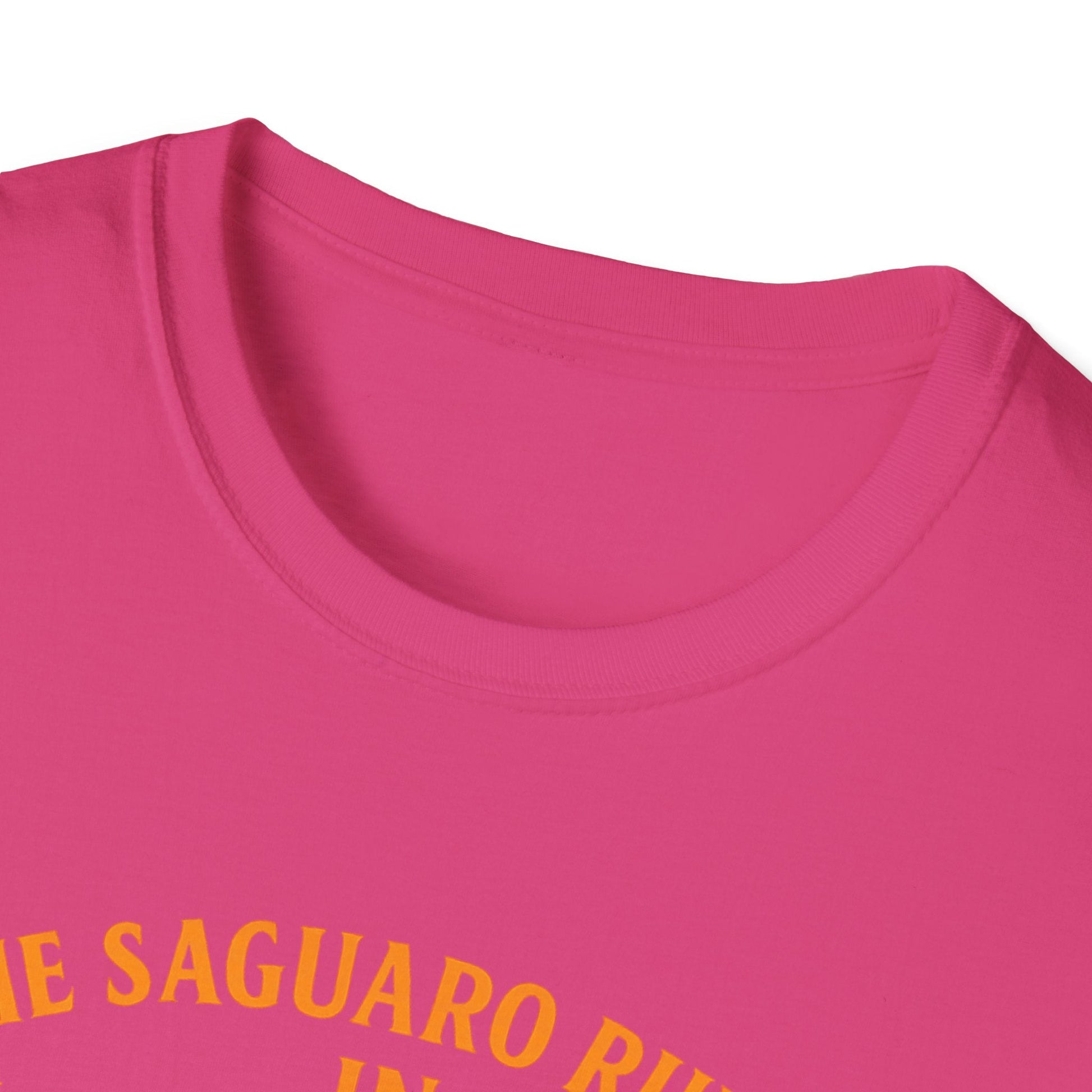 Close-up of Arizona Saguaro Sunset unisex softstyle t-shirt in vibrant pink with bold yellow text design.