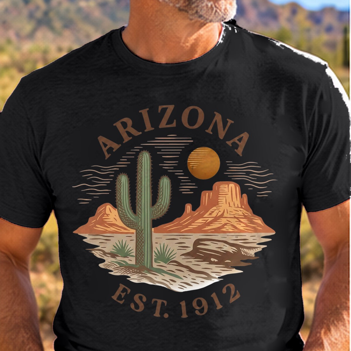 Desert Graphic Est 1912 Arizona T-shirt worn by a man in the Arizona desert