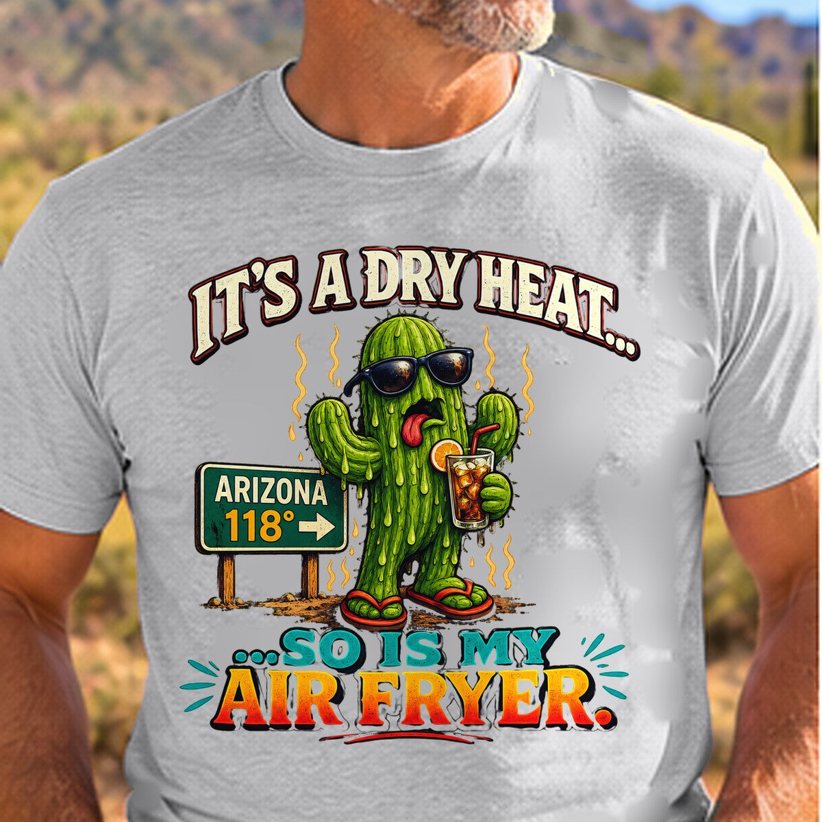 Dry Heat Air Fryer Arizona T-shirt worn by a man in the Arizona desert