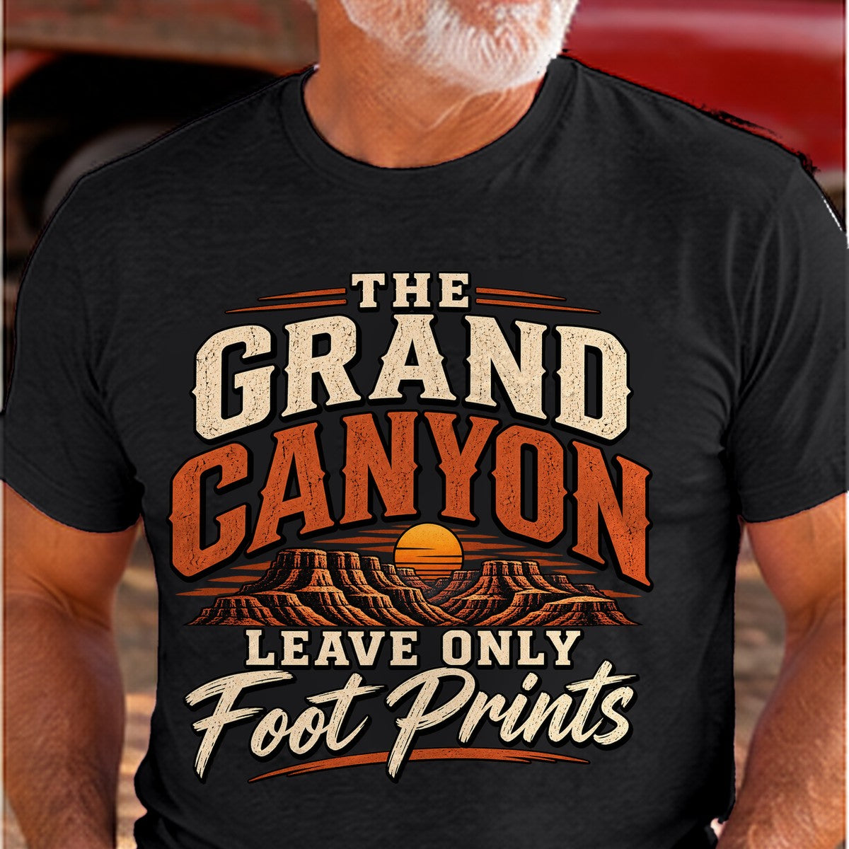 Grand Canyon Footprints Arizona T-shirt worn by a man in the Arizona desert