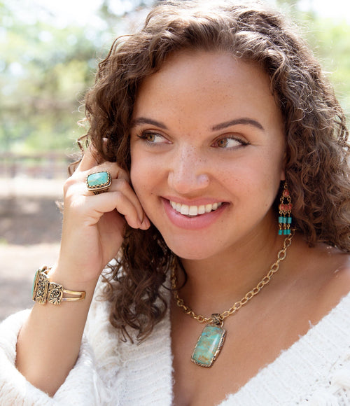 Jacquard turquoise pendant necklace with floral golden bronze setting, view 2