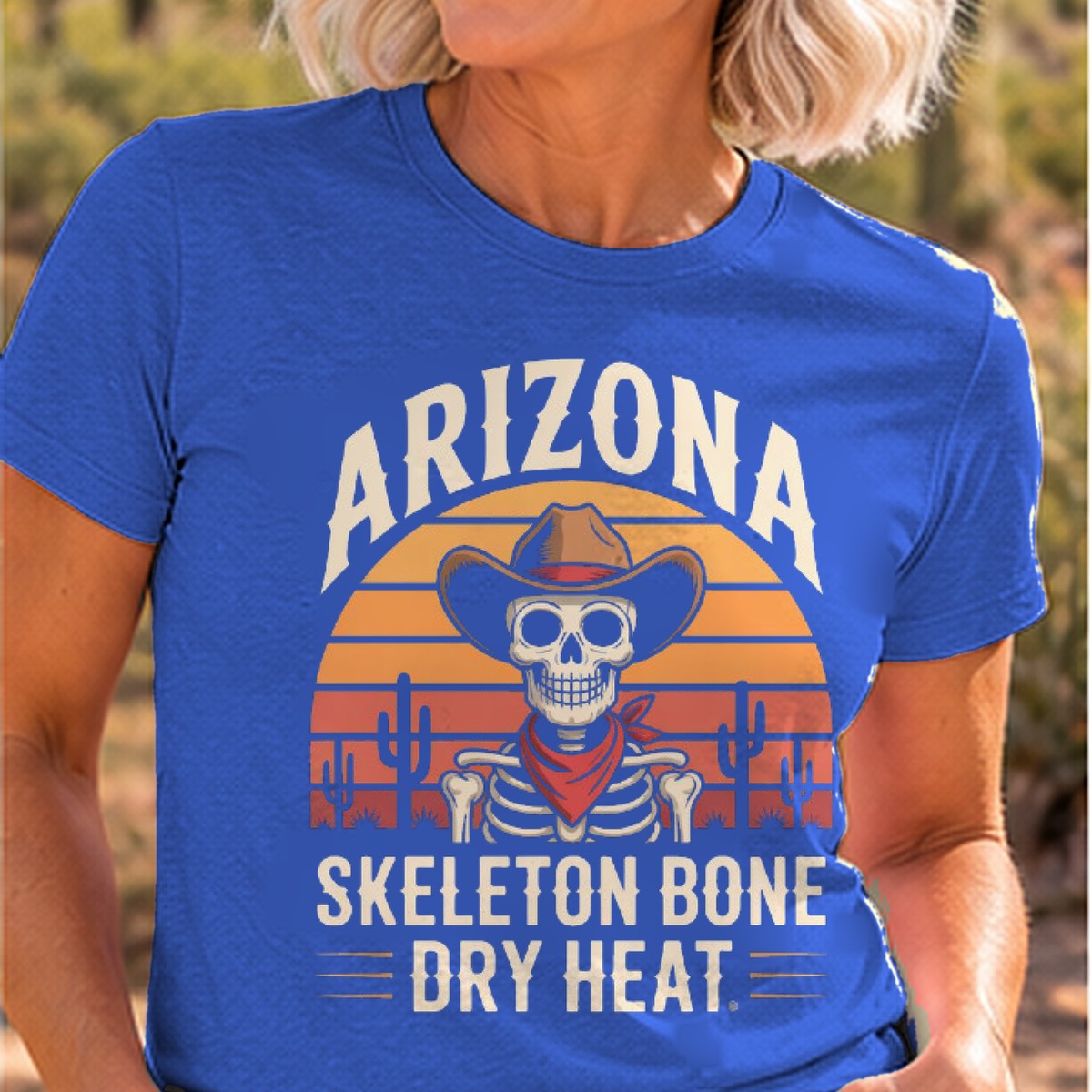 Skeleton Bone Dry Heat Arizona T-shirt worn by a woman in the Arizona desert