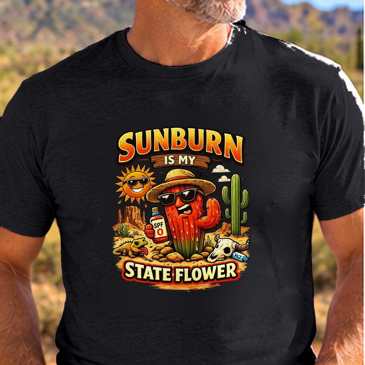 Sunburn State Flower Arizona T-shirt worn by a man in the Arizona desert
