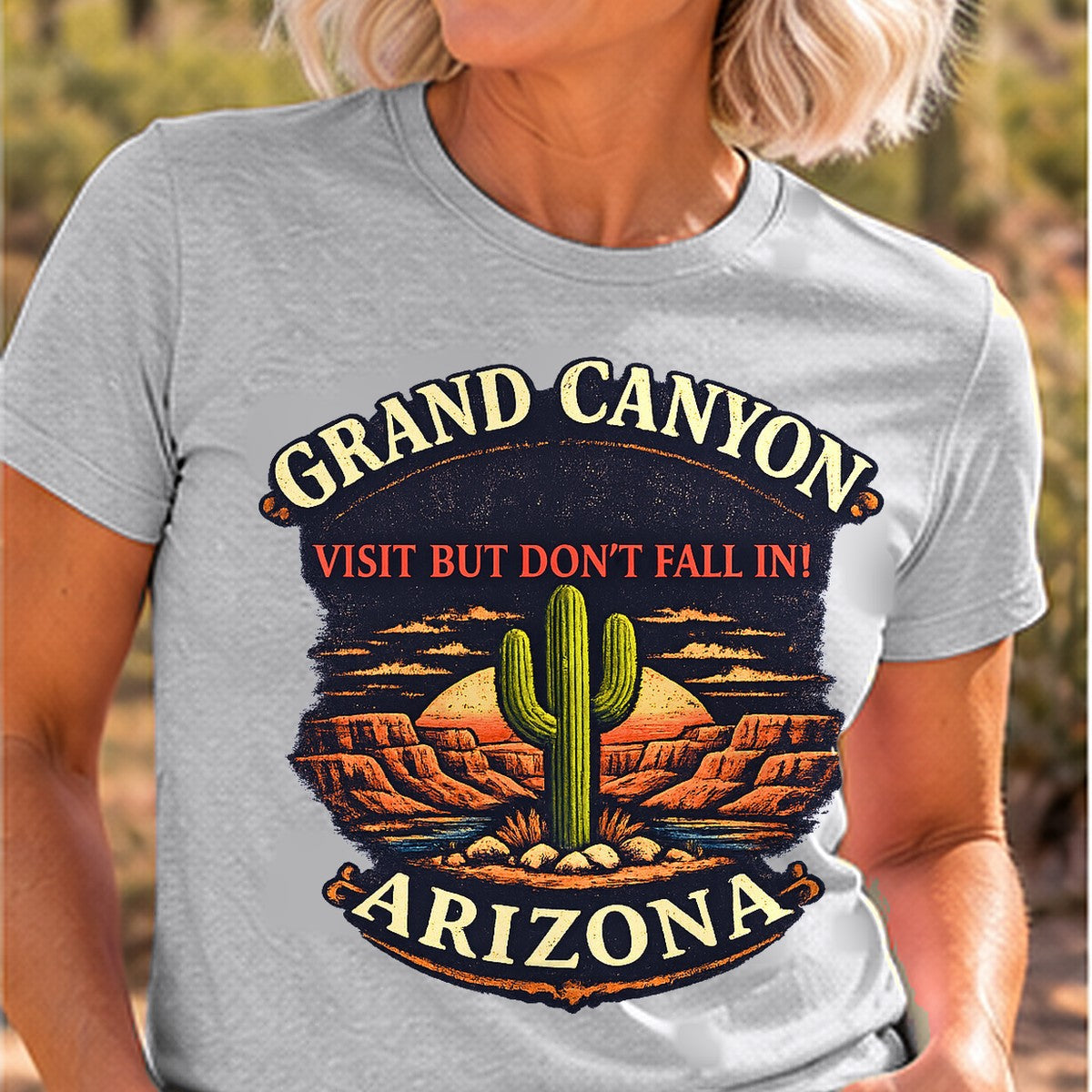 Visit But Dont Fall In Arizona T-shirt worn by a woman in the Arizona desert